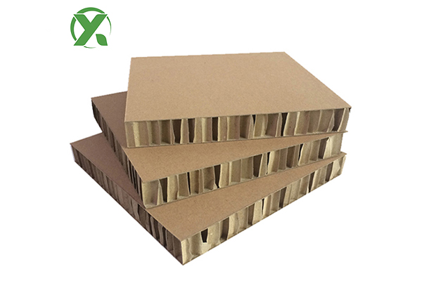 How does honeycomb paperboard perform in heavy-duty product packaging?